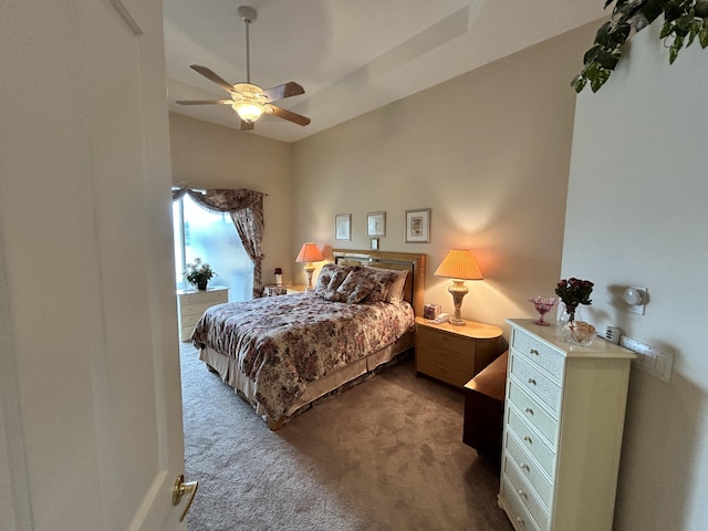 bedroom with a ceiling fan and carpet flooring