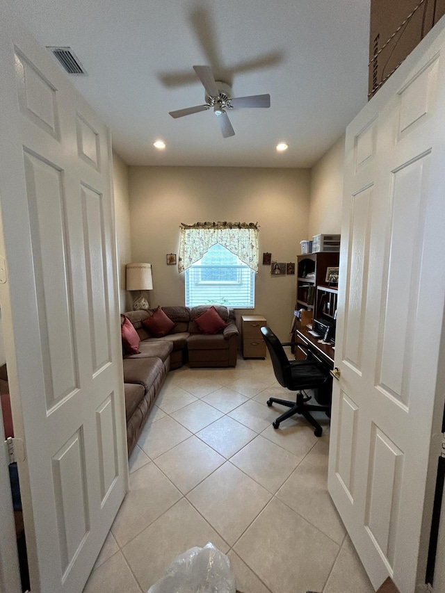 office space featuring light tile patterned floors, ceiling fan, visible vents, and recessed lighting