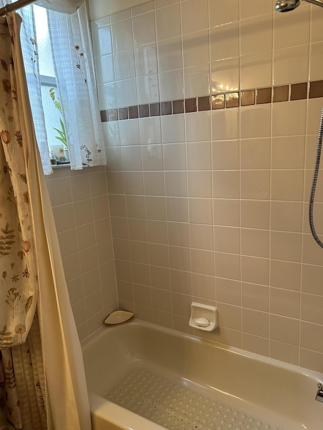full bathroom with shower / tub combo