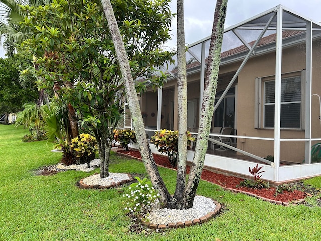 view of yard featuring a lanai