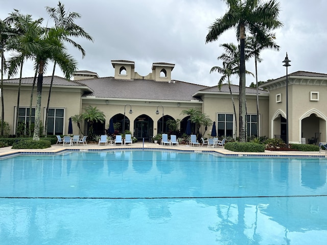 community pool featuring a patio area