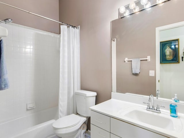 full bathroom featuring shower / tub combo, vanity, and toilet