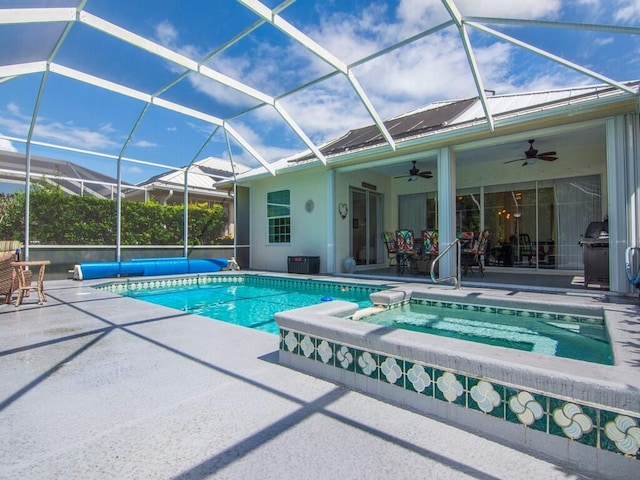 view of swimming pool featuring a lanai, ceiling fan, an in ground hot tub, and a patio