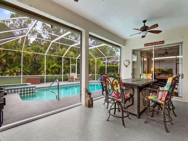 view of swimming pool featuring a lanai and a patio