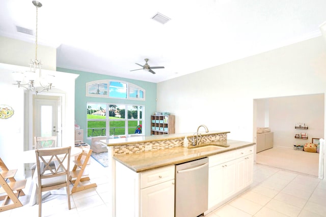 kitchen featuring tasteful backsplash, light tile patterned floors, a kitchen island, white cabinetry, and stainless steel appliances