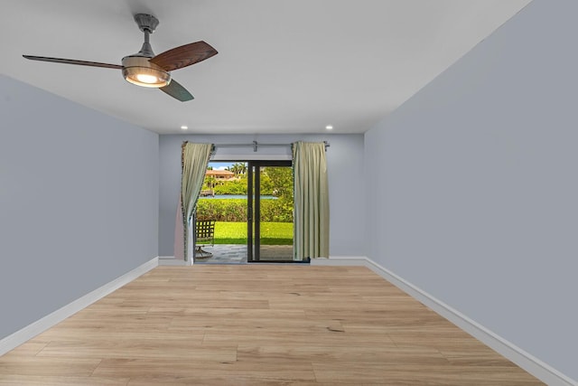 unfurnished room with ceiling fan and light hardwood / wood-style floors