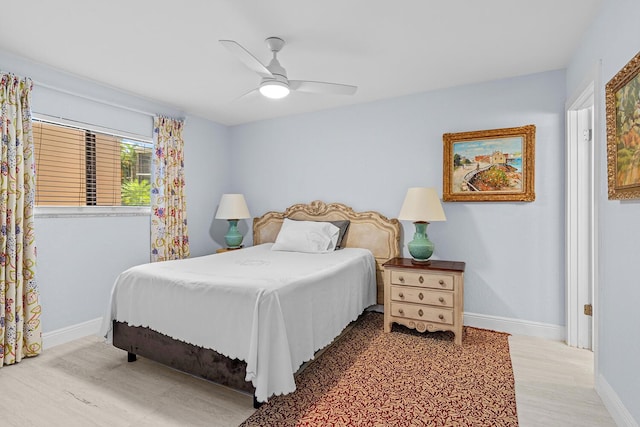 bedroom with hardwood / wood-style flooring and ceiling fan