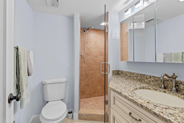 bathroom with toilet, an enclosed shower, and vanity