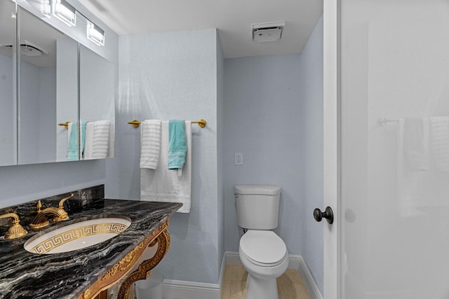 bathroom featuring sink and toilet