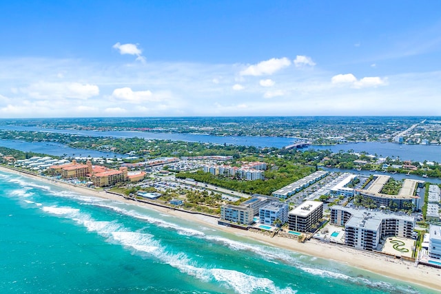 aerial view with a water view and a view of the beach