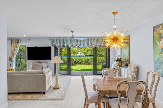 dining room with ceiling fan with notable chandelier