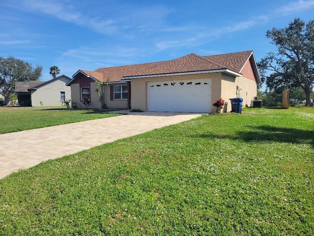 single story home with central AC, a front yard, and a garage