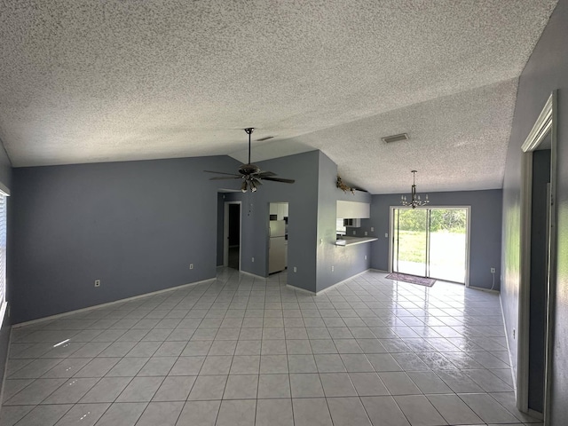 unfurnished living room featuring ceiling fan with notable chandelier, light tile patterned floors, and vaulted ceiling