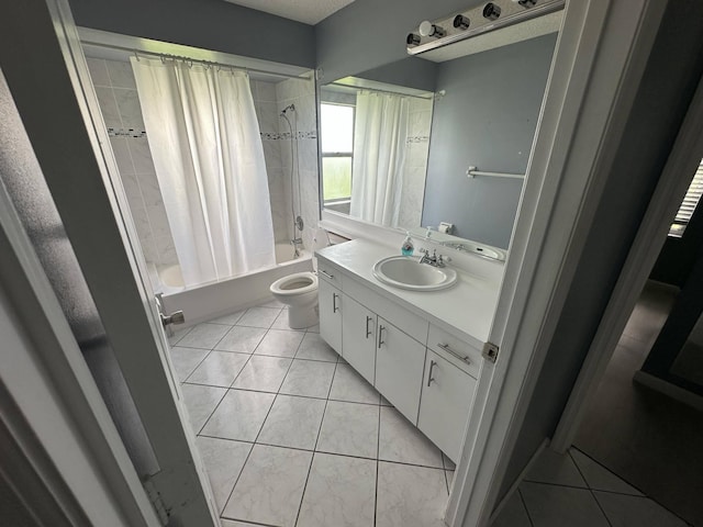 full bathroom with tile patterned floors, vanity, toilet, and shower / bath combo