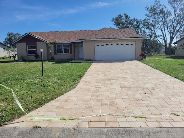 ranch-style house featuring a garage and a front lawn