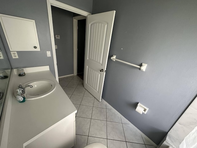 bathroom featuring tile patterned flooring and vanity