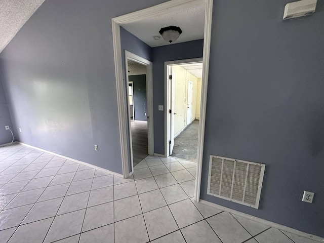 interior space with a textured ceiling