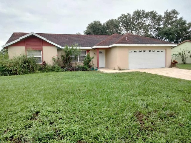 ranch-style house featuring a garage and a front lawn