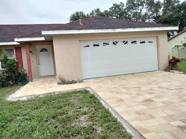 ranch-style house featuring a garage