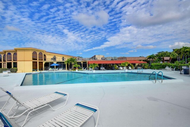 view of patio / terrace featuring a community pool