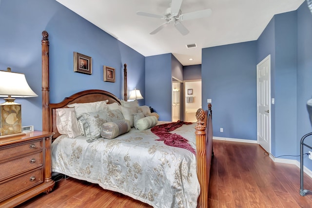 bedroom with ceiling fan and dark wood-type flooring