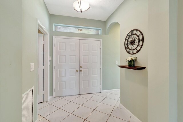 foyer with light tile patterned floors