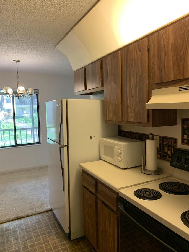 kitchen featuring hanging light fixtures, a notable chandelier, electric range oven, white refrigerator, and dark colored carpet