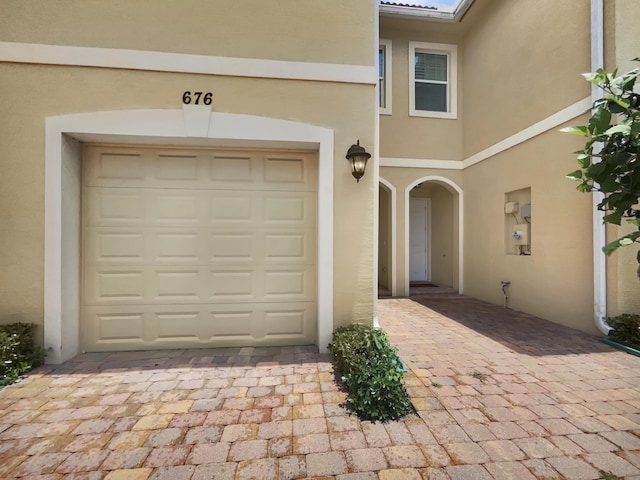 property entrance featuring a garage