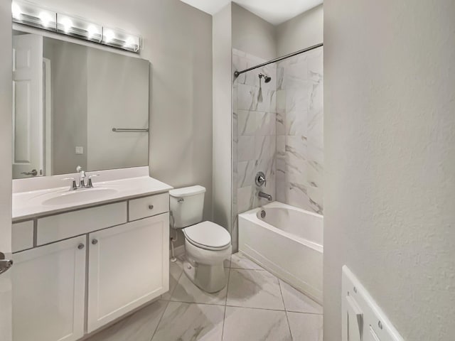 full bathroom featuring vanity, toilet, and tiled shower / bath