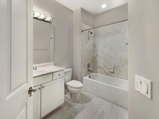 full bathroom featuring vanity, toilet, and tiled shower / bath