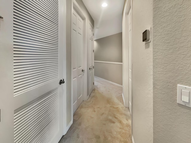 corridor with light carpet