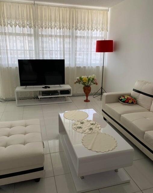 living room featuring light tile patterned flooring