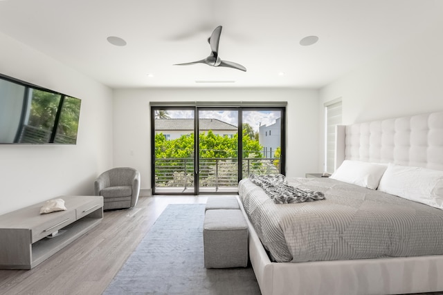 bedroom featuring light hardwood / wood-style flooring, access to exterior, and ceiling fan