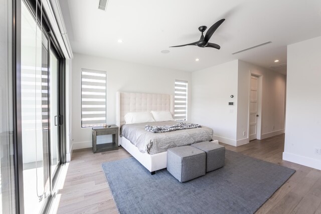 bedroom featuring ceiling fan and light hardwood / wood-style flooring