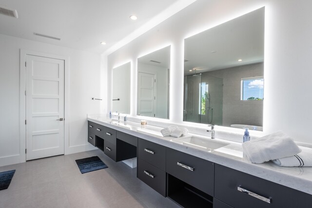 bathroom with vanity and an enclosed shower