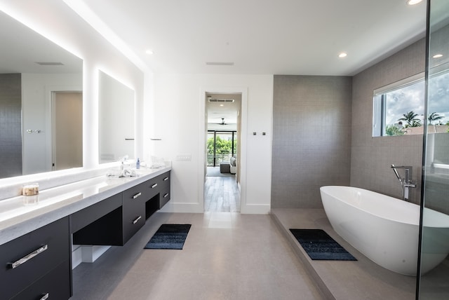 bathroom featuring vanity and separate shower and tub