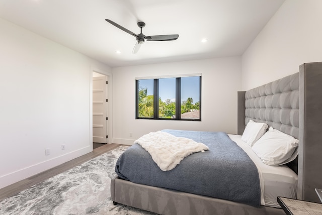 bedroom featuring hardwood / wood-style floors and ceiling fan