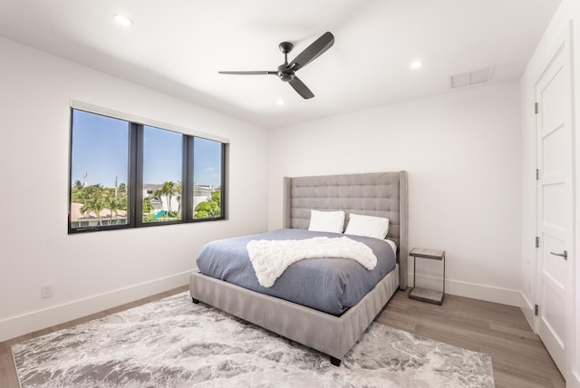 bedroom featuring light wood-type flooring and ceiling fan