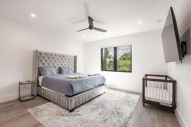 bedroom featuring ceiling fan and hardwood / wood-style floors