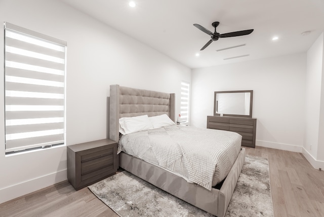 bedroom with light wood-type flooring and ceiling fan