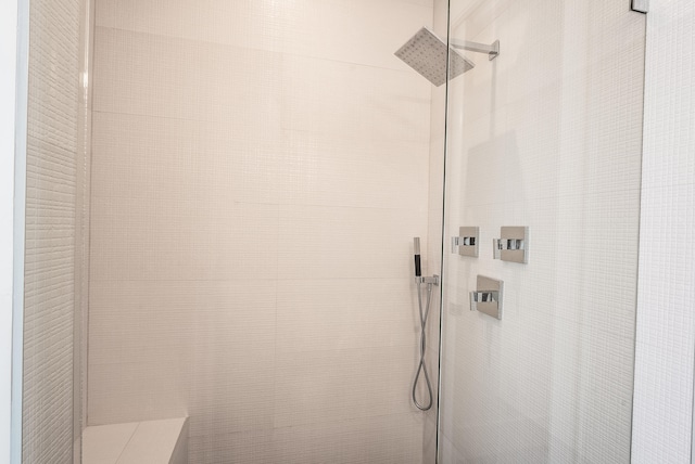 bathroom with tiled shower