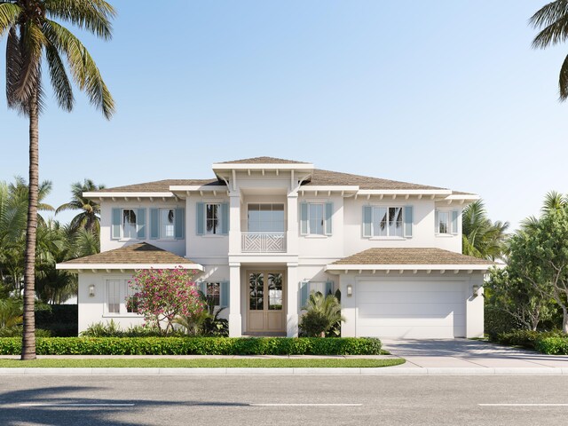 view of front of home featuring a garage and a balcony