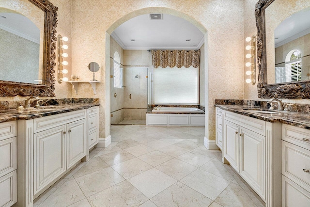 bathroom featuring shower with separate bathtub, vanity, and crown molding