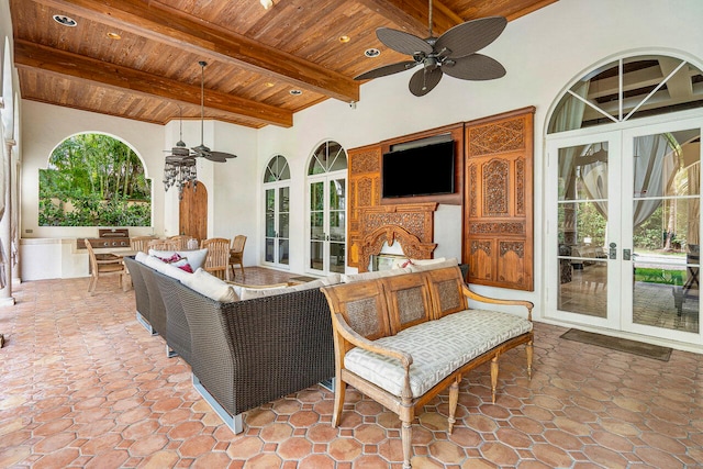 view of patio featuring an outdoor living space, ceiling fan, and french doors