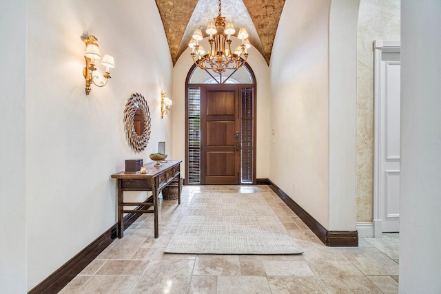 foyer featuring brick ceiling, vaulted ceiling with beams, and a notable chandelier