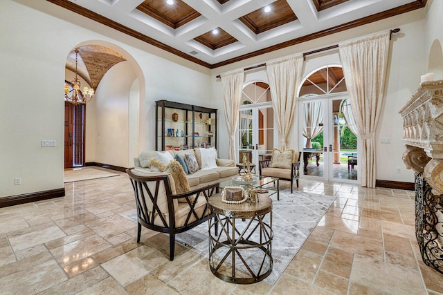 living room with french doors, a towering ceiling, ornamental molding, coffered ceiling, and beam ceiling