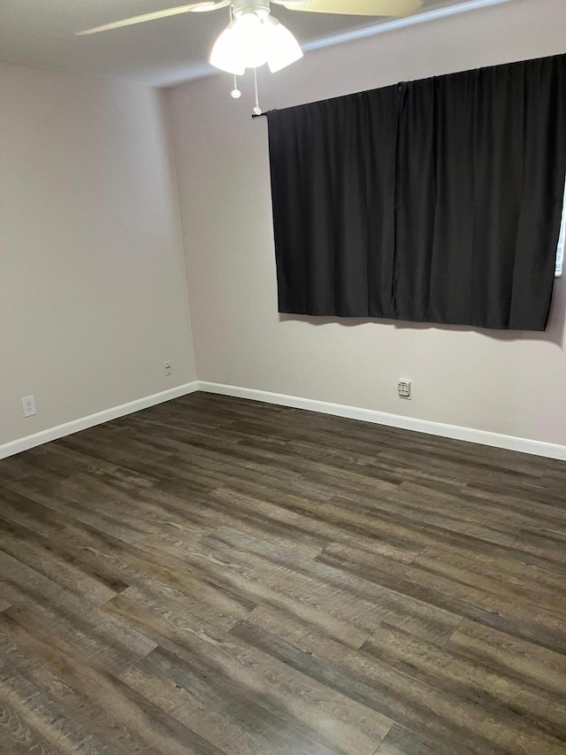 unfurnished room with dark hardwood / wood-style floors