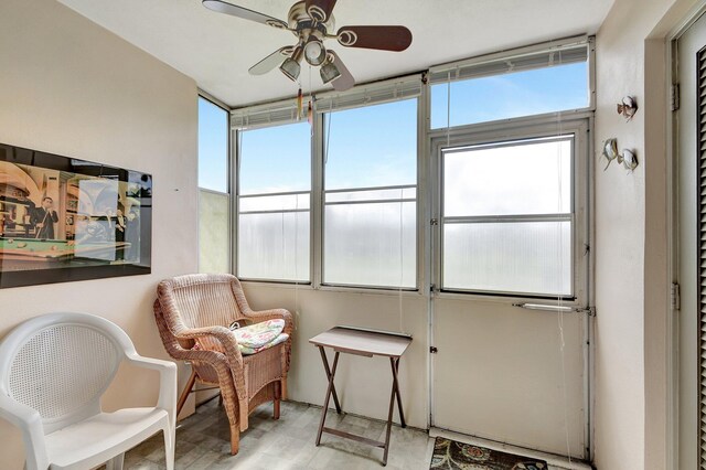 sunroom / solarium with ceiling fan