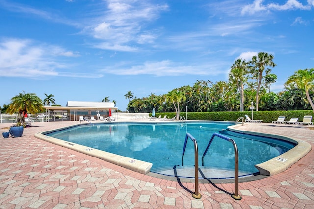 view of swimming pool featuring a patio area