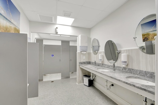 bathroom with vanity and a shower